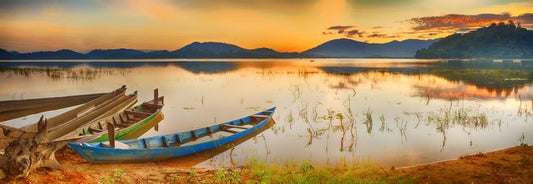 Rowing boats at sundown