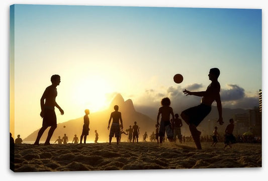 Beach football at sunset, Brazil