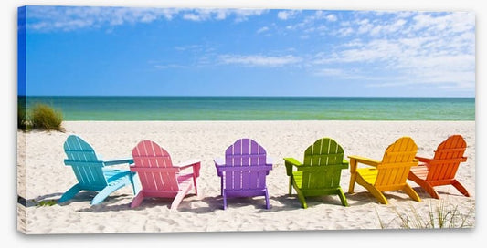 Rainbow chairs on a sunny beach