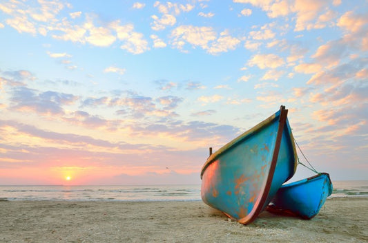 Blue boats at sunrise