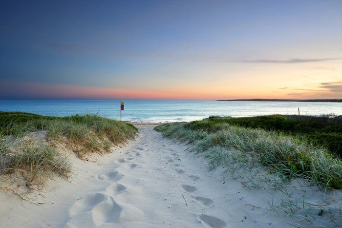 Sandy beach trail at sundown