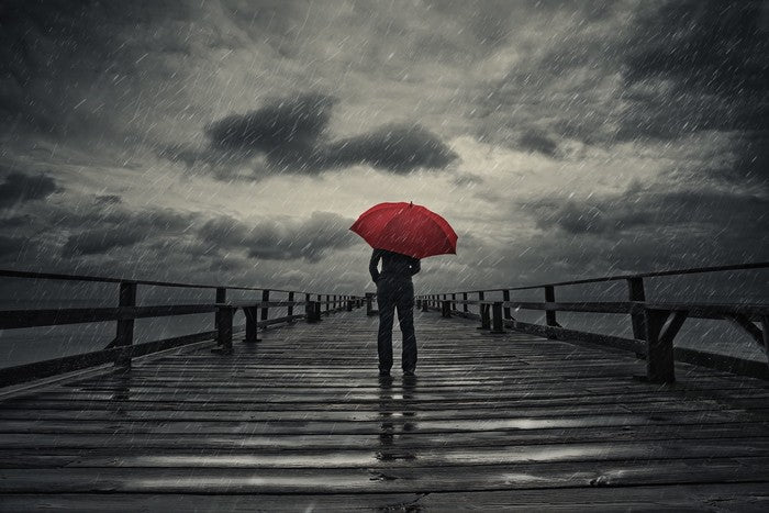 Red umbrella in the storm