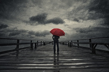 Red umbrella in the storm