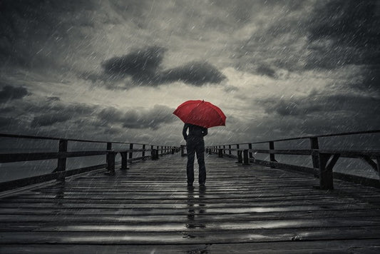 Red umbrella in the storm