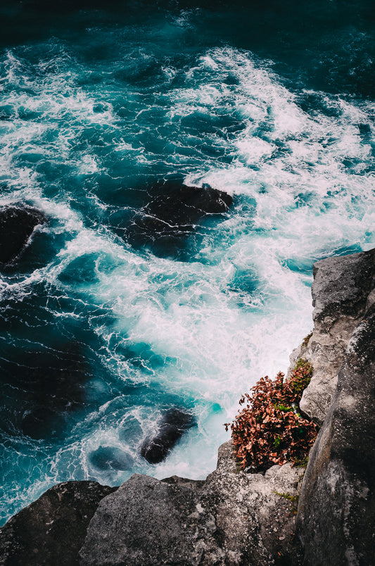 Below the ocean cliff